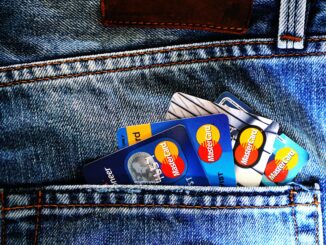 Credit score in South Africa – multiple credit cards in a jeans pocket representing debt and credit usage