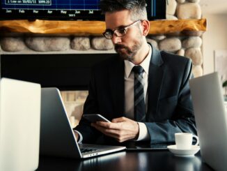 Internal sales administrator in an IT office environment, preparing quotes on a computer for data capture solutions.