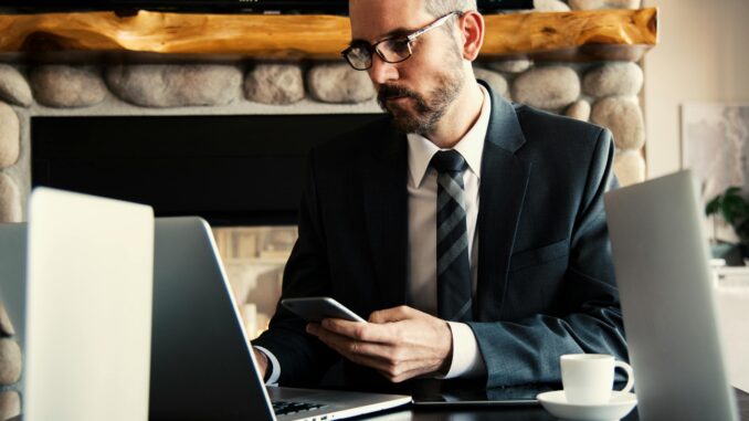 Internal sales administrator in an IT office environment, preparing quotes on a computer for data capture solutions.