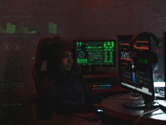 Cybersecurity analyst monitoring security dashboards on multiple screens